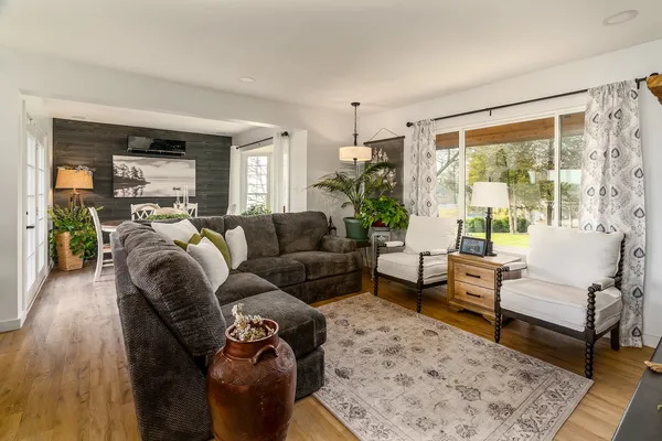 a living room with furniture and a large window