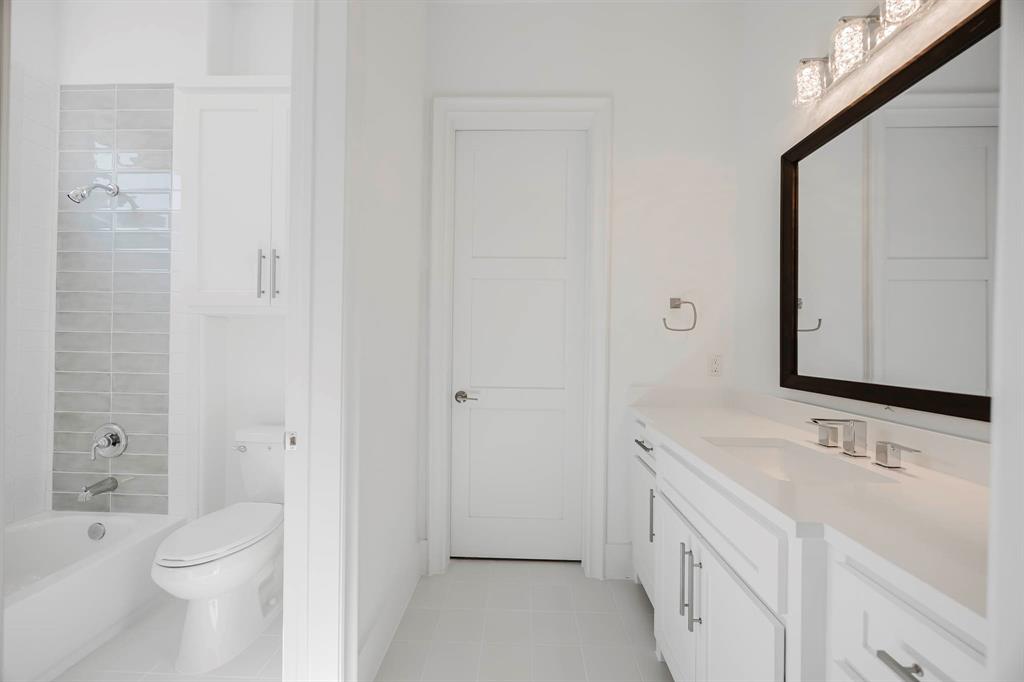 2081 Holt Way Grapevine, TX 76051 - Photo 30 of 40 a bathroom with a sink a toilet and shower