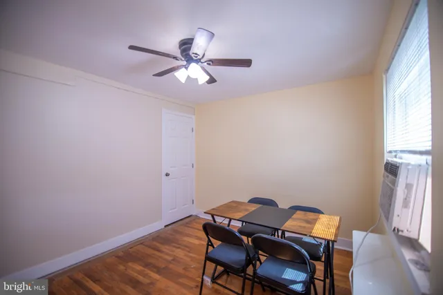 a view of a workspace with furniture and window