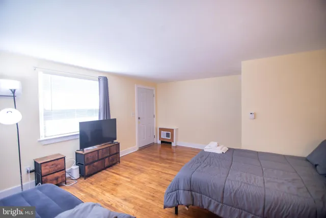 a bedroom with a bed and furniture