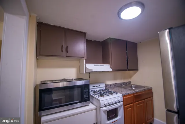 a kitchen with a stove and a microwave