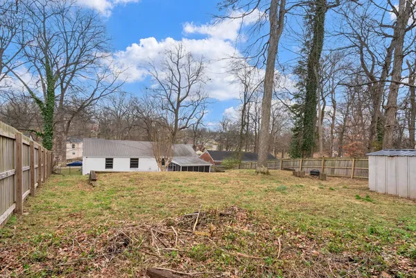 a backyard of a house with lots of green space