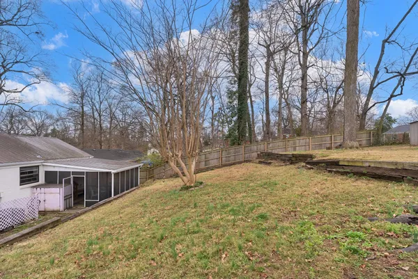 a backyard of a house with lots of green space