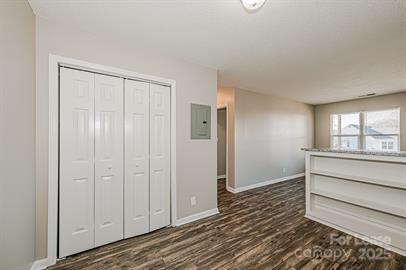 238 Hoskins Mill Lane, Unit D Charlotte, NC 28208 - Photo 5 of 13 a view of an empty room with wooden floor and a window