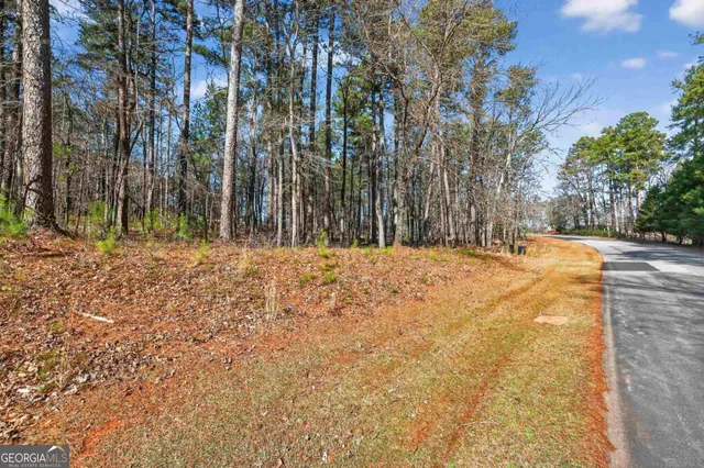 a kitchen with a table chairs stove and cabinets