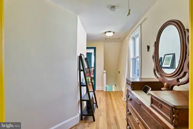 a view of a bathroom with a tub and mirror