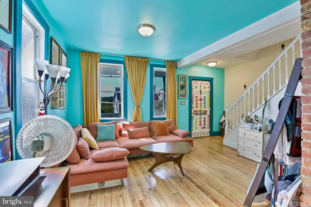 a living room with furniture and a rug