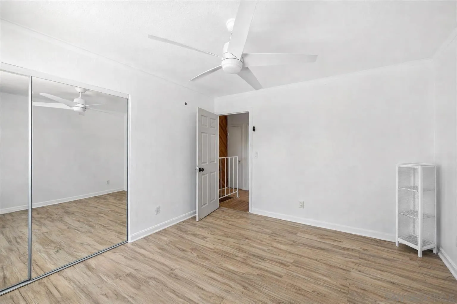 2127 Berry Street Lemon Grove, CA 91945 - Photo 11 of 25 a view of an empty room with wooden floor