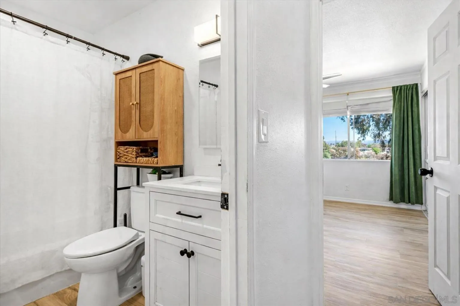 2127 Berry Street Lemon Grove, CA 91945 - Photo 12 of 25 a bathroom with a shower a toilet and a sink