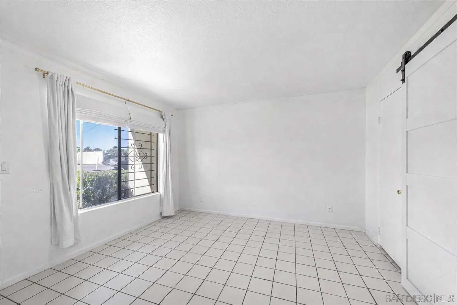 2127 Berry Street Lemon Grove, CA 91945 - Photo 17 of 25 a view of an empty room with window