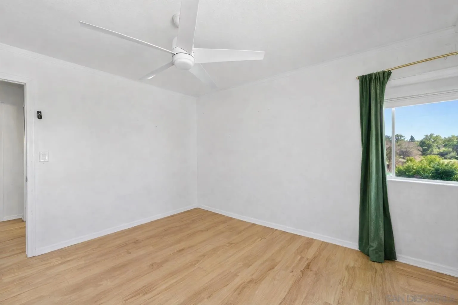 2127 Berry Street Lemon Grove, CA 91945 - Photo 8 of 25 a view of empty room with wooden floor and fan