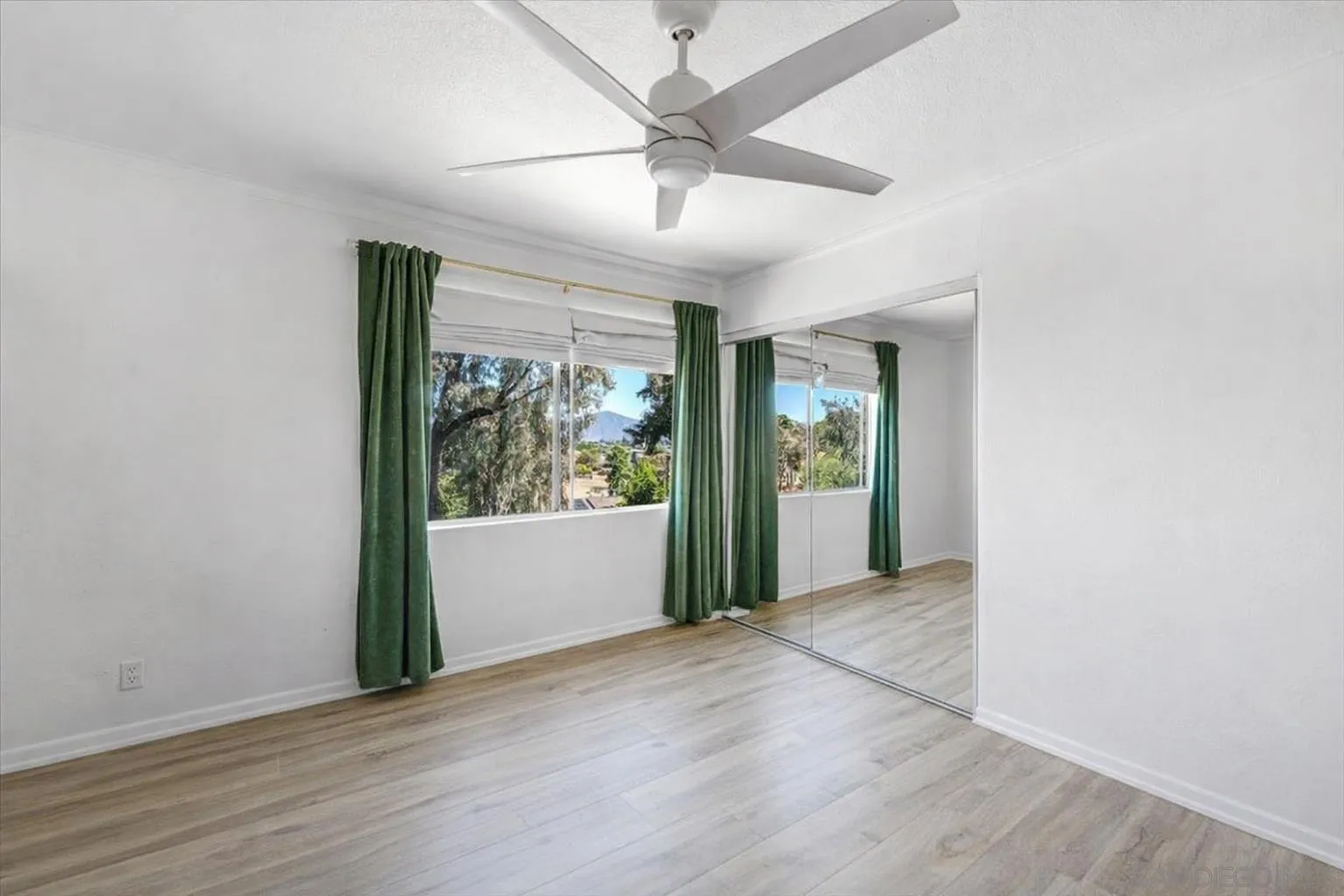 2127 Berry Street Lemon Grove, CA 91945 - Photo 9 of 25 wooden floor in an empty room with a window
