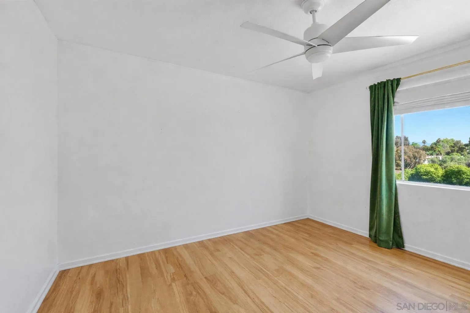 2127 Berry Street Lemon Grove, CA 91945 - Photo 10 of 25 a view of empty room with wooden floor and fan