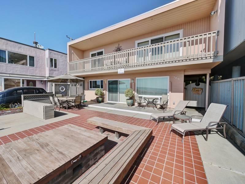 309 Beach Drive Aptos, CA 95003 - Photo 2 of 14 a view of a patio with couches table and chairs with wooden floor
