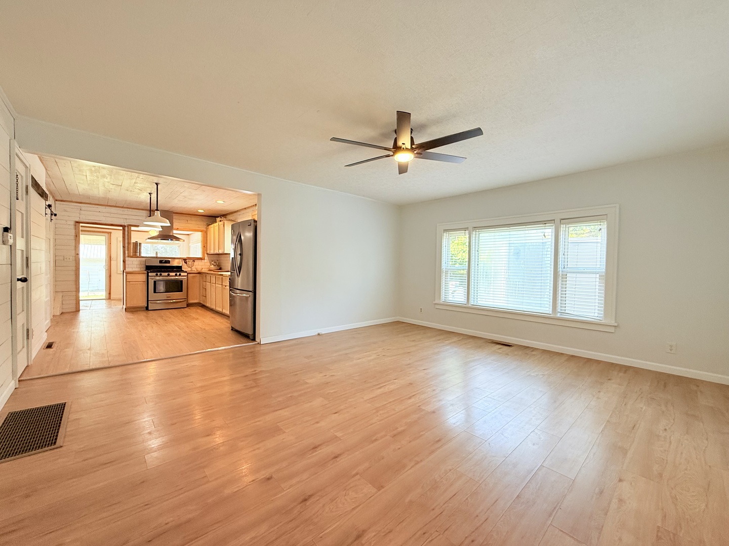 90 Pickering Road Harrisburg, IL 62946 - Photo 5 of 15 a view of a livingroom with wooden floor and a window