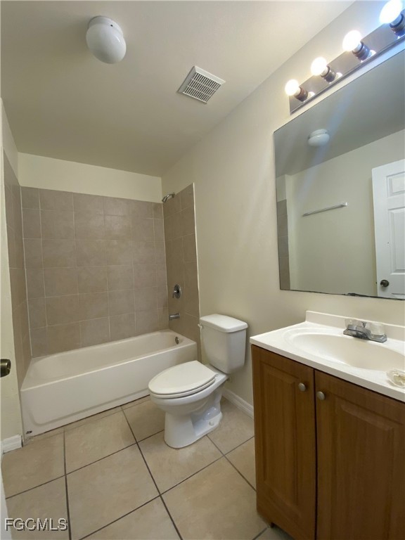 4622 15th Street Southwest Lehigh Acres, FL 33973 - Photo 11 of 15 a bathroom with a sink a toilet and shower