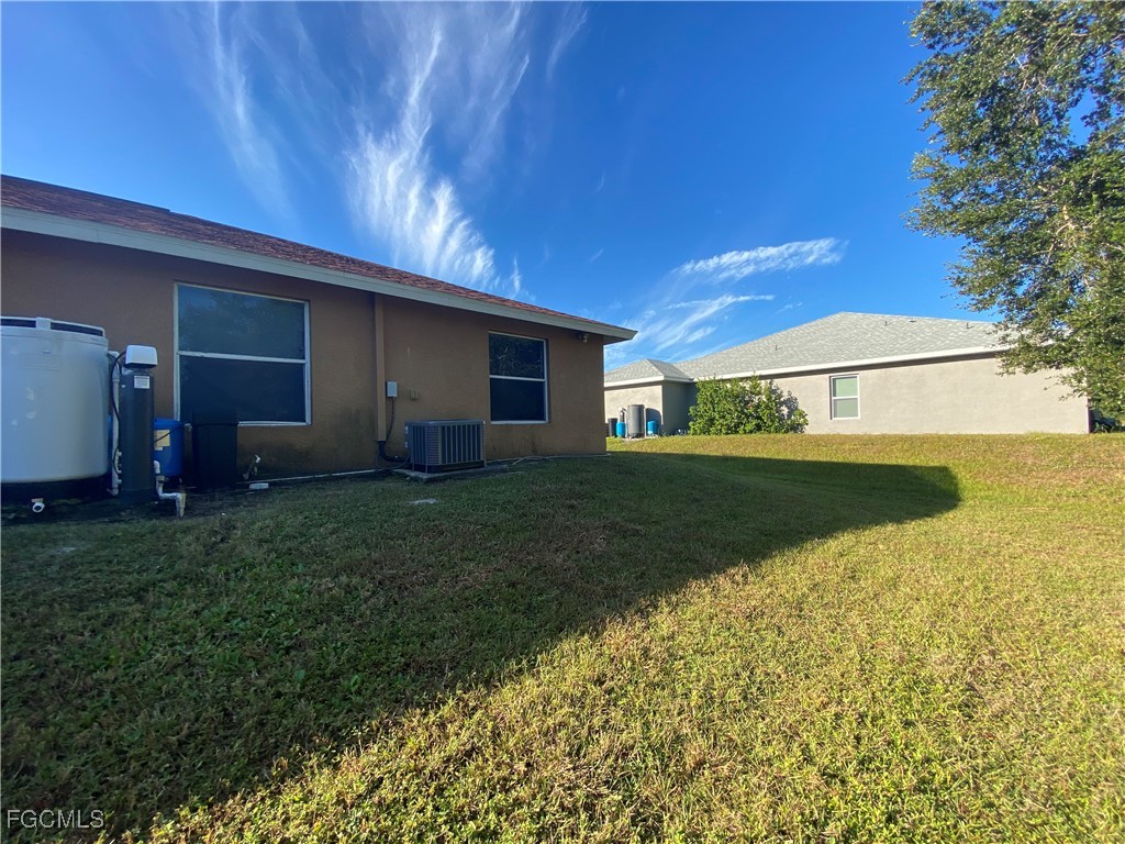 4622 15th Street Southwest Lehigh Acres, FL 33973 - Photo 14 of 15 a view of a porch with a yard