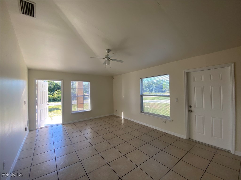 4622 15th Street Southwest Lehigh Acres, FL 33973 - Photo 2 of 15 an empty room with windows and closet