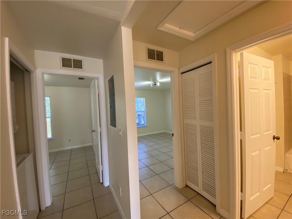 4622 15th Street Southwest Lehigh Acres, FL 33973 - Photo 9 of 15 a bathroom with a glass shower door