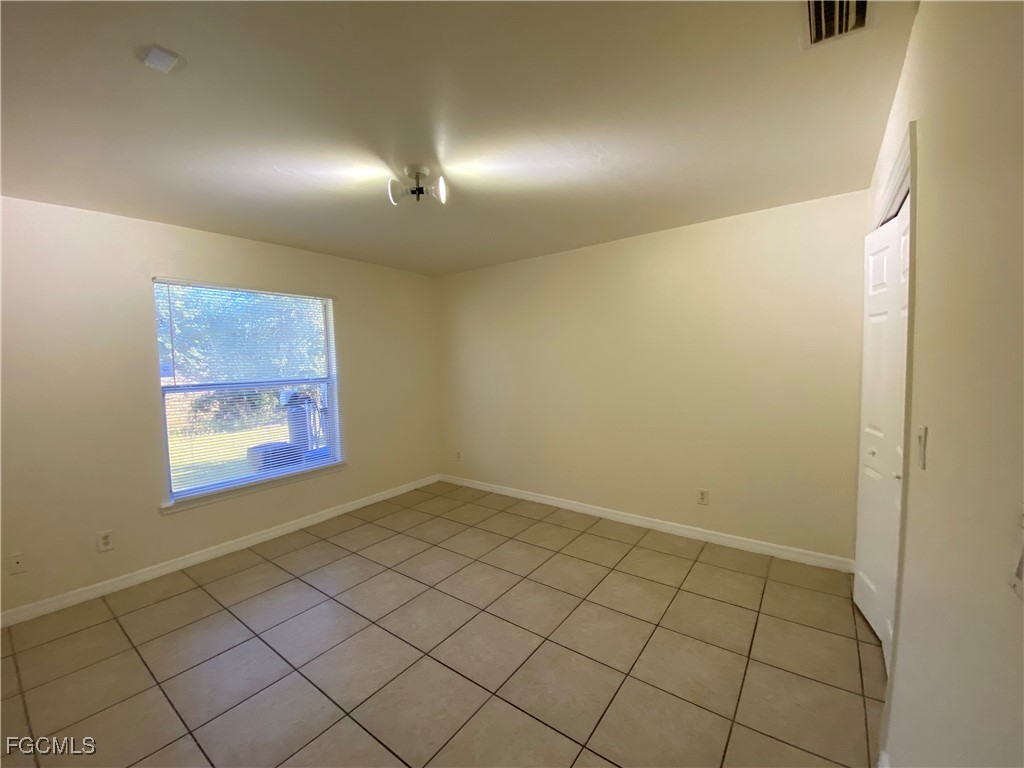 4622 15th Street Southwest Lehigh Acres, FL 33973 - Photo 10 of 15 a view of an empty room and window