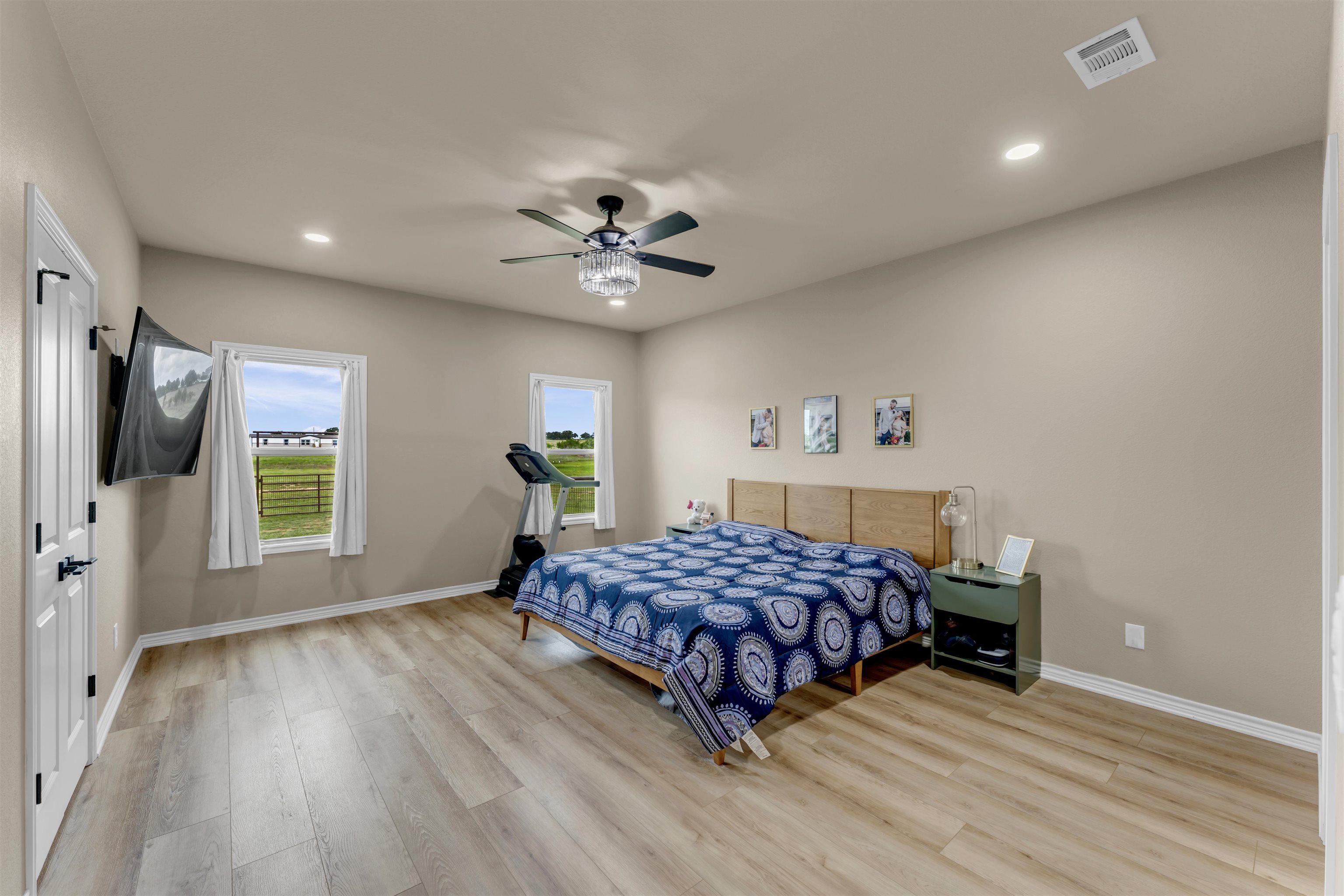 494 Johnson Road Mason, TX 76856 - Photo 16 of 28 a bedroom with a bed and a chandelier