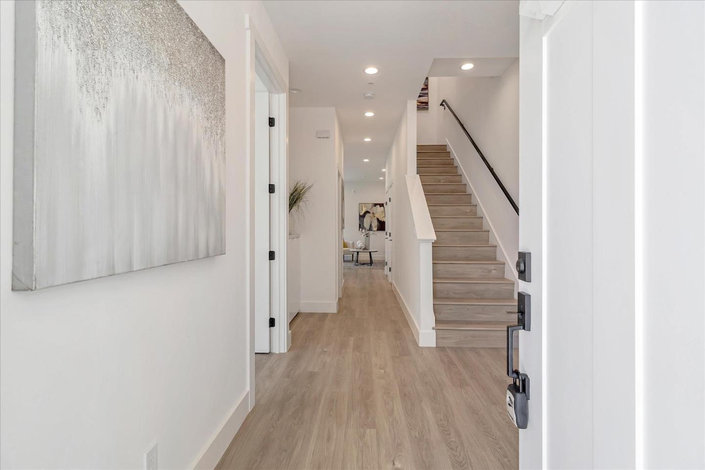 1998 Montecito Avenue Mountain View, CA 94043 - Photo 14 of 29 a view of a hallway with wooden floor and staircase