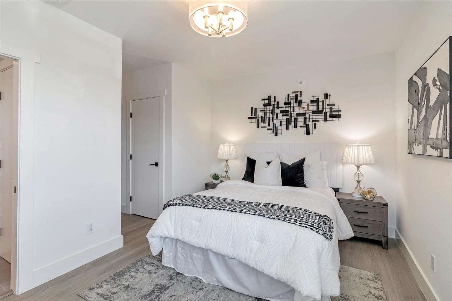 1998 Montecito Avenue Mountain View, CA 94043 - Photo 17 of 29 a bedroom with a bed and a chandelier