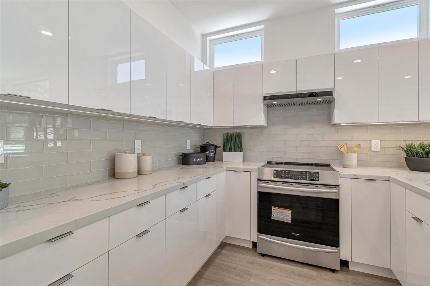 1998 Montecito Avenue Mountain View, CA 94043 - Photo 5 of 29 a kitchen with granite countertop cabinets stainless steel appliances and wooden floor