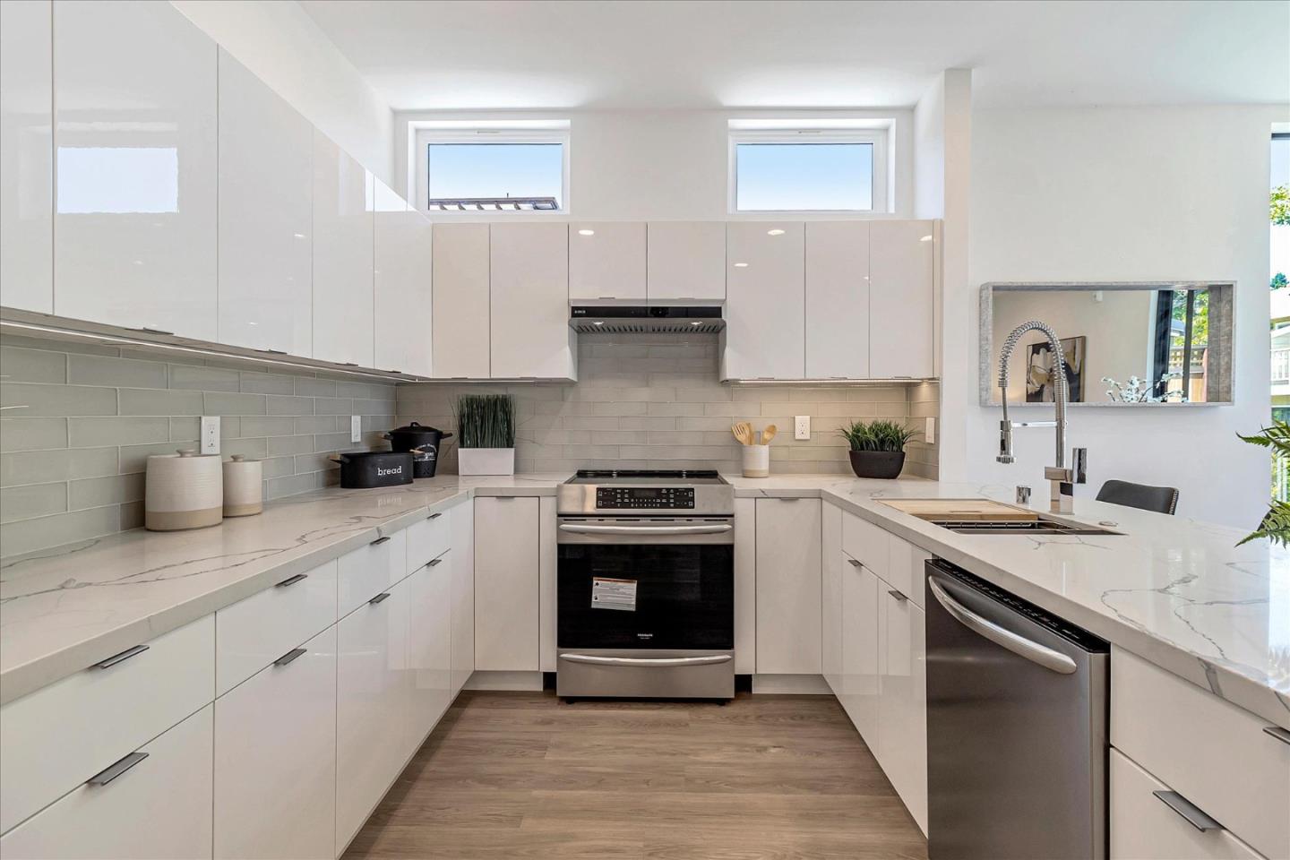 1998 Montecito Avenue Mountain View, CA 94043 - Photo 6 of 29 a kitchen with stainless steel appliances granite countertop a stove sink and cabinets