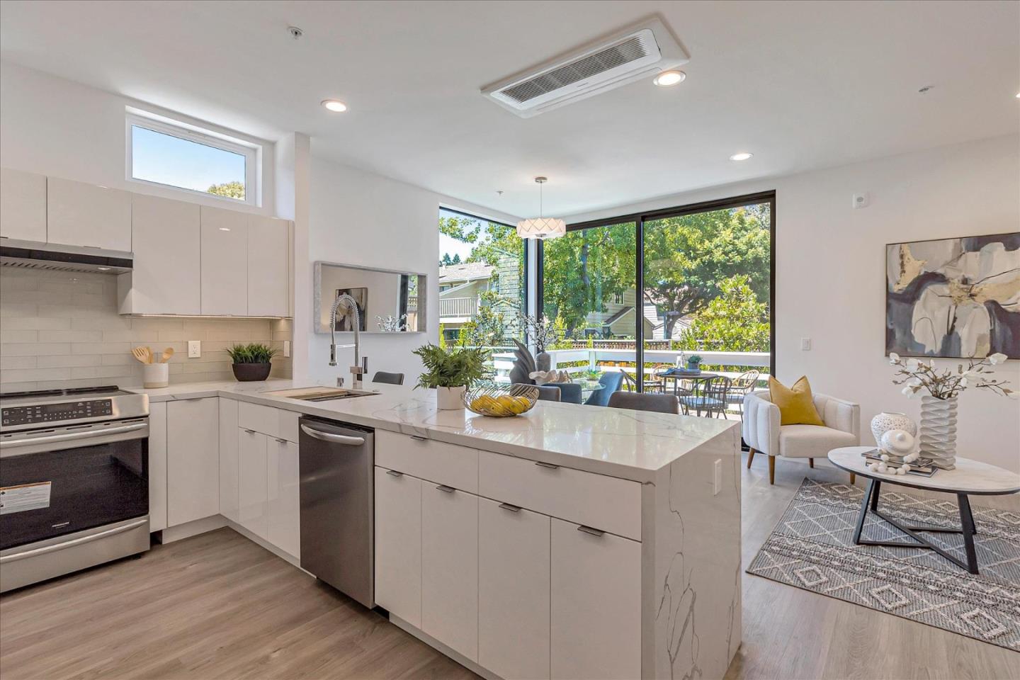 1998 Montecito Avenue Mountain View, CA 94043 - Photo 7 of 29 a kitchen with a stove a sink a dining table and chairs
