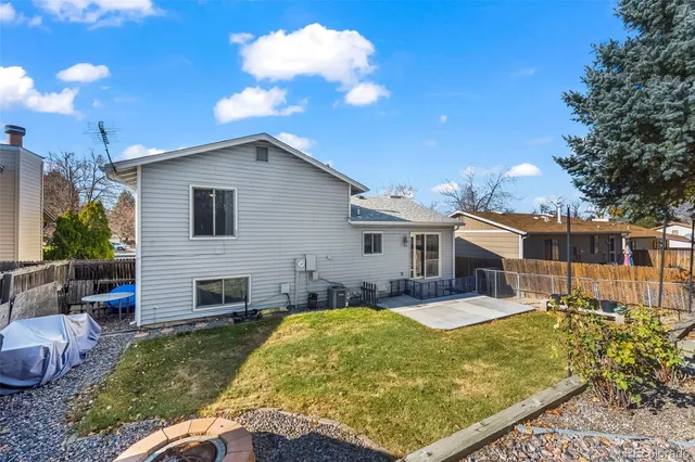 a view of a house with swimming pool patio and fire pit