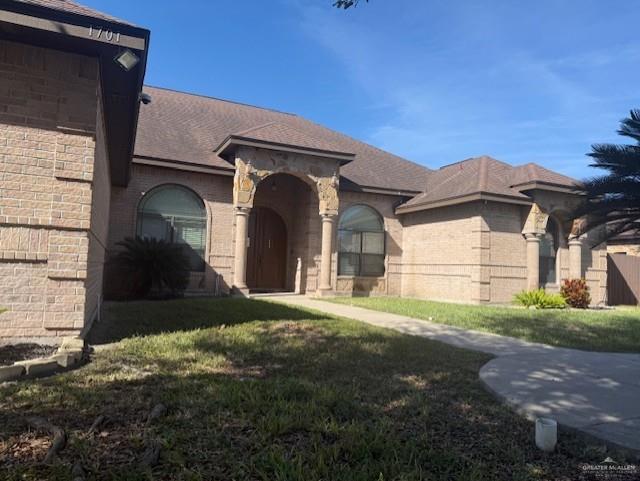 1701 North Ebony Street Pharr, TX 78577 - Photo 3 of 4 a view of a house with a yard