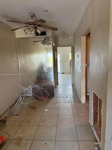 a kitchen with a sink appliances and cabinets