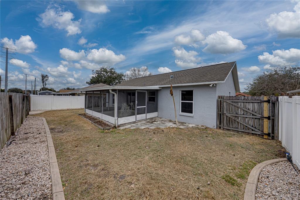 4752 Timber Way Zephyrhills, FL 33542 - Photo 46 of 46 a view of a house with a sink and wooden fence