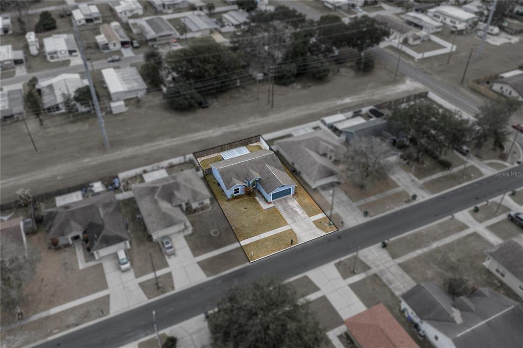 4752 Timber Way Zephyrhills, FL 33542 - Photo 5 of 46 an aerial view of a residential building with parking