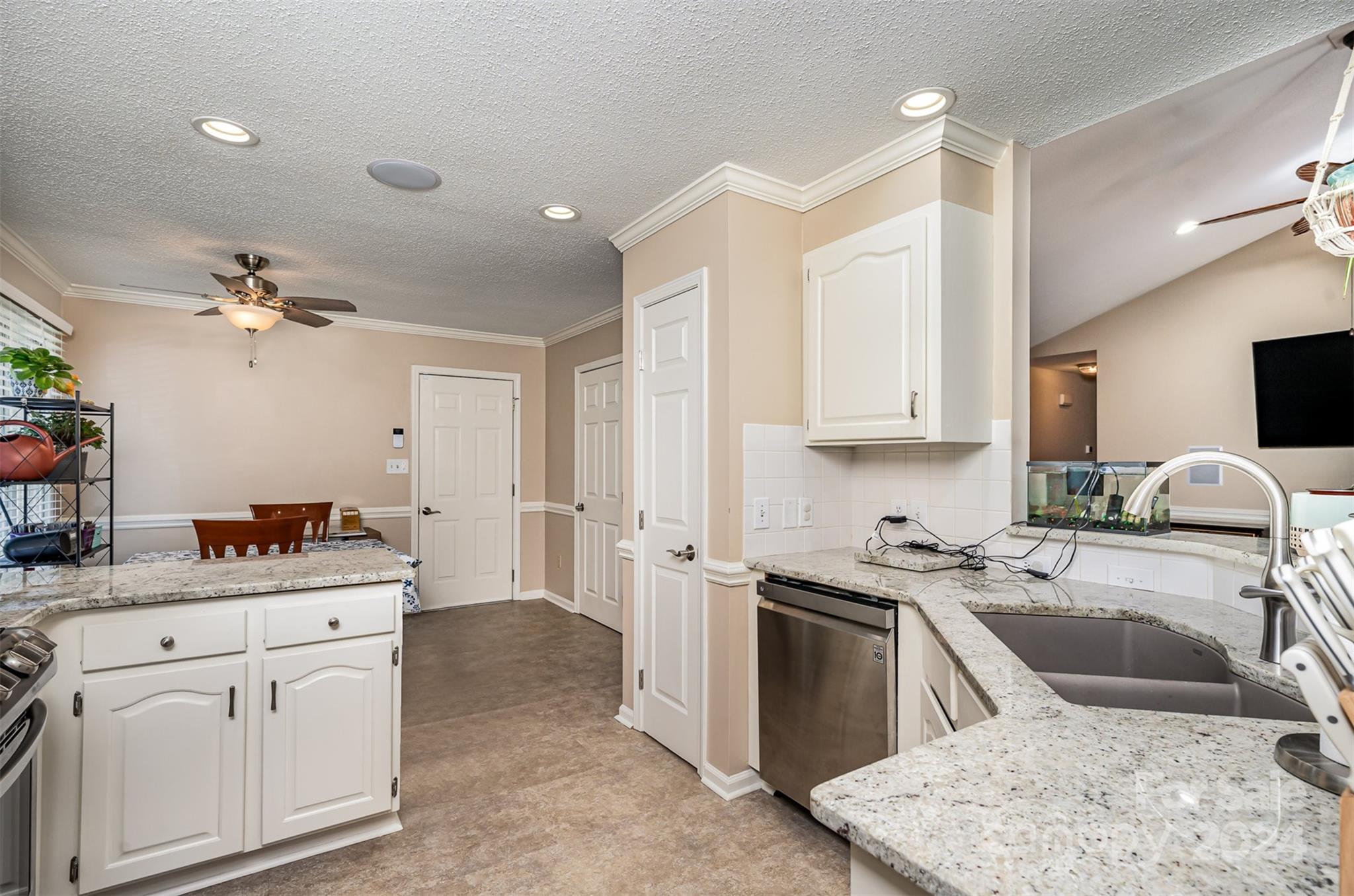 708 1st Avenue North Conover, NC 28613 - Photo 11 of 26 a kitchen with a sink stove and cabinets