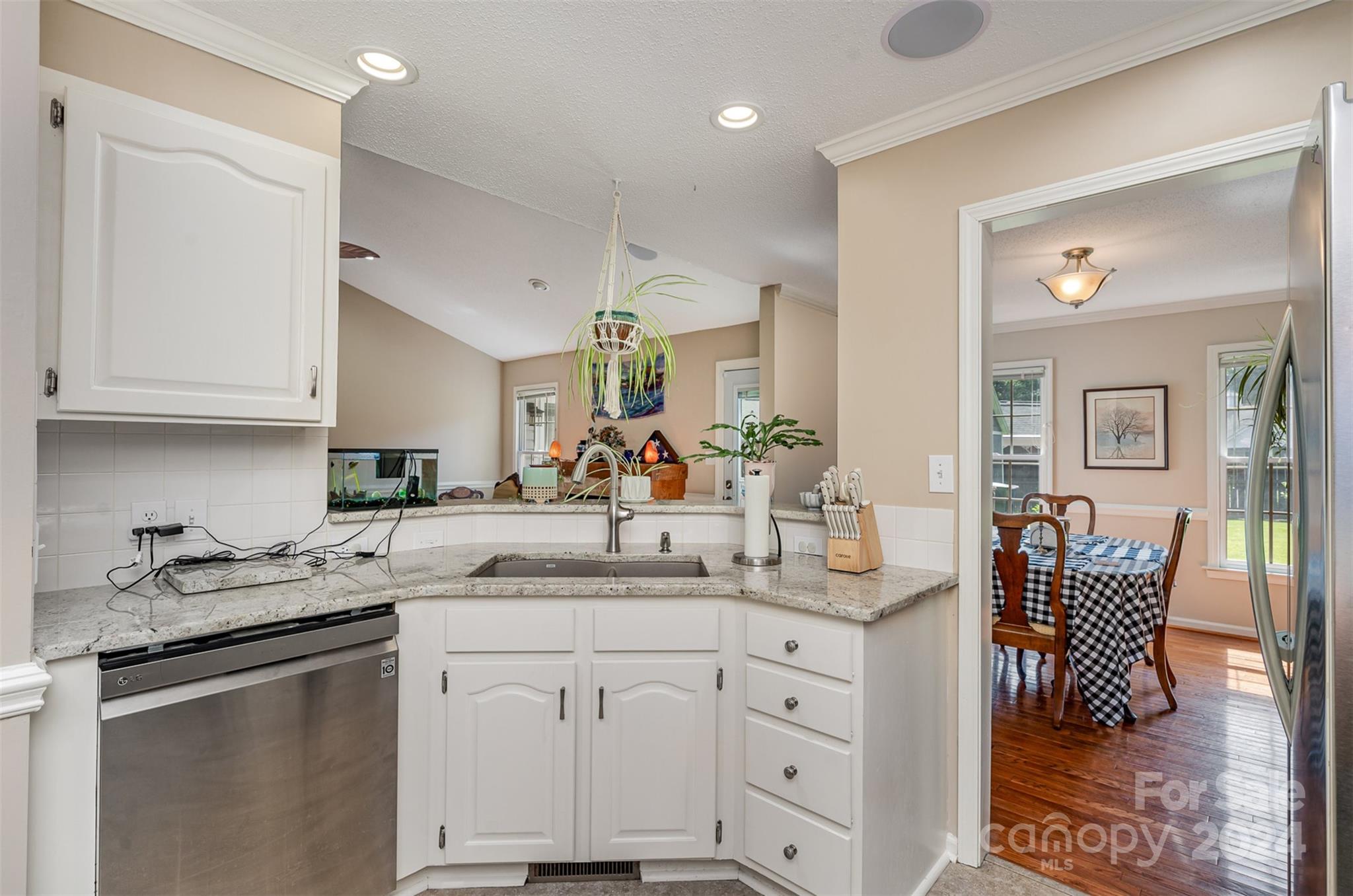 708 1st Avenue North Conover, NC 28613 - Photo 13 of 26 a kitchen with stainless steel appliances granite countertop a sink and cabinets