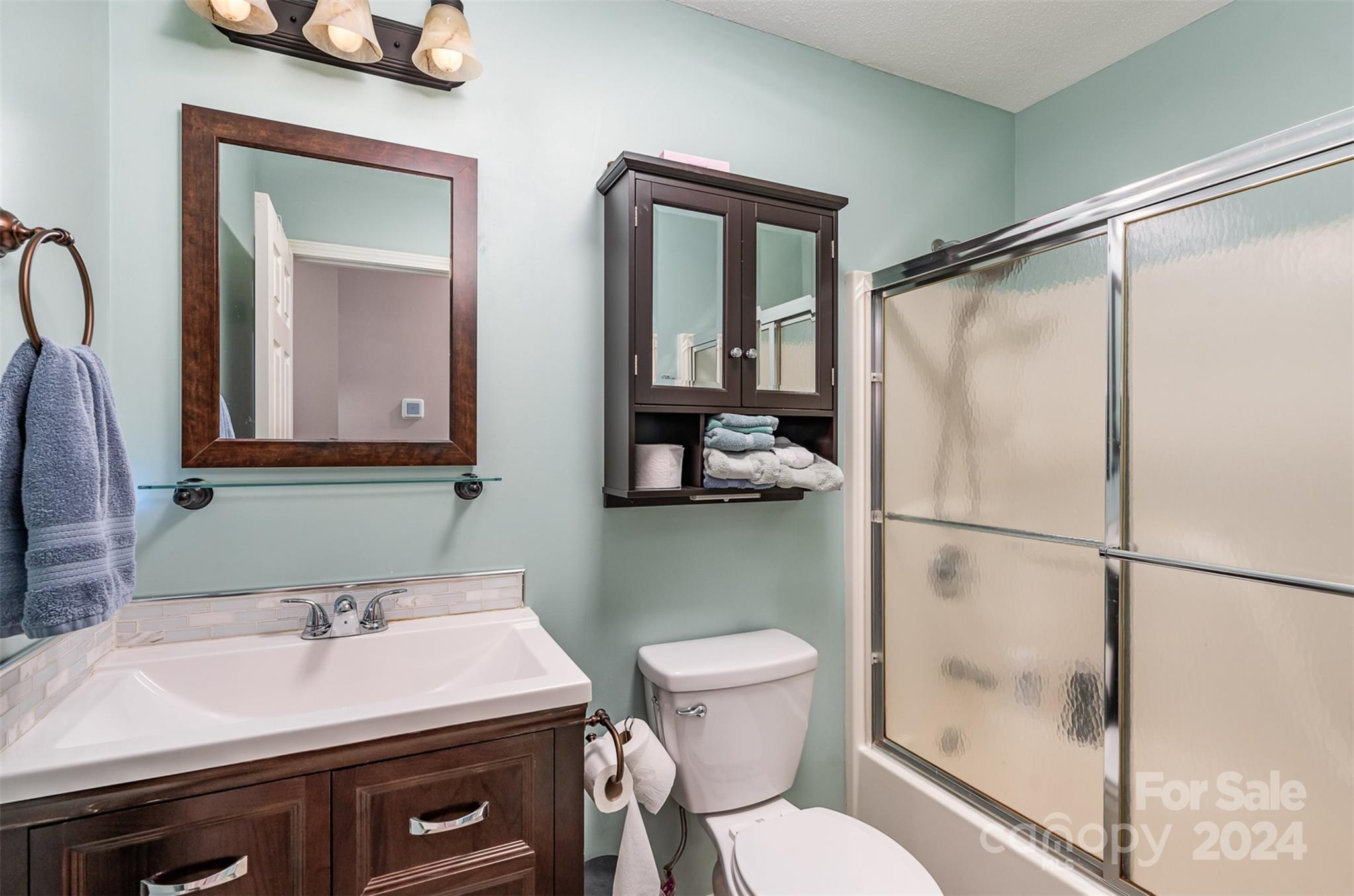 708 1st Avenue North Conover, NC 28613 - Photo 15 of 26 a bathroom with a sink toilet and mirror