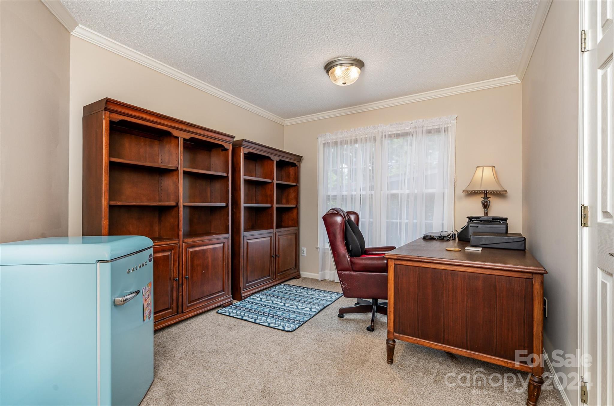 708 1st Avenue North Conover, NC 28613 - Photo 16 of 26 a view of a workspace with furniture and a window