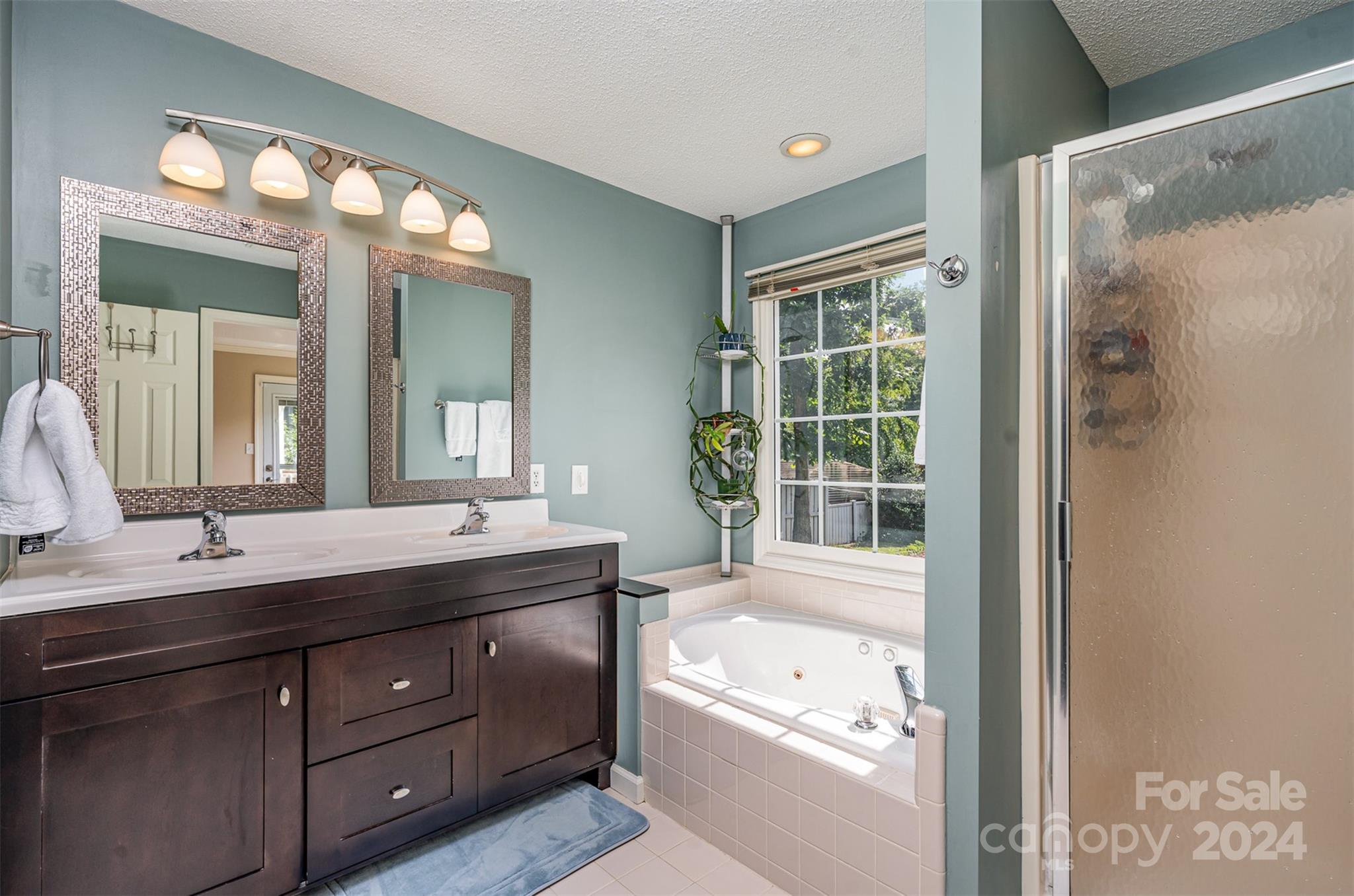 708 1st Avenue North Conover, NC 28613 - Photo 18 of 26 a bathroom with a granite countertop sink mirror bathtub and double
