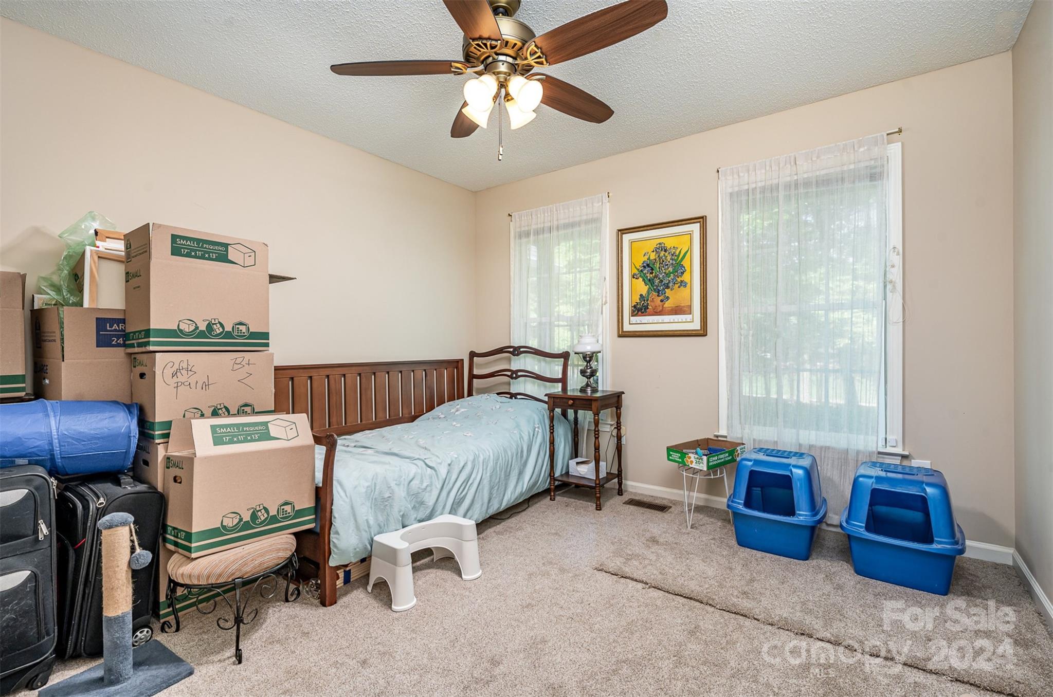708 1st Avenue North Conover, NC 28613 - Photo 21 of 26 a bedroom with furniture and a chandelier