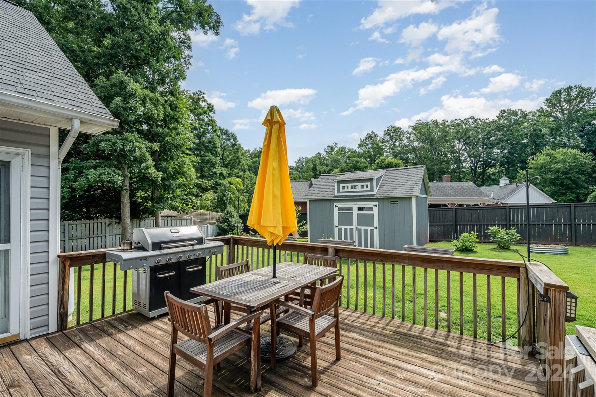 708 1st Avenue North Conover, NC 28613 - Photo 22 of 26 a view of a deck with a table and chairs