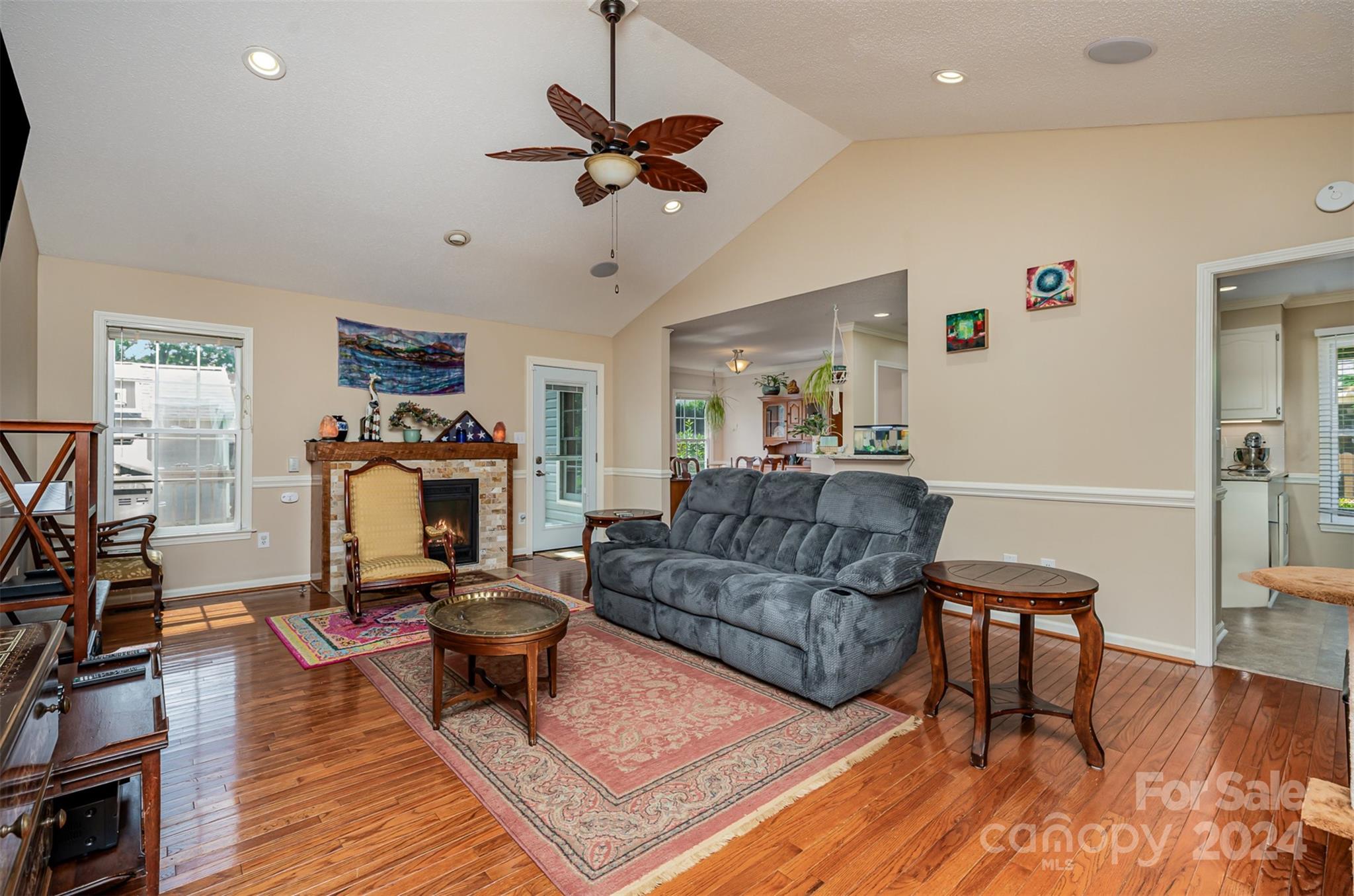 708 1st Avenue North Conover, NC 28613 - Photo 6 of 26 a living room with furniture a fireplace and a flat screen tv