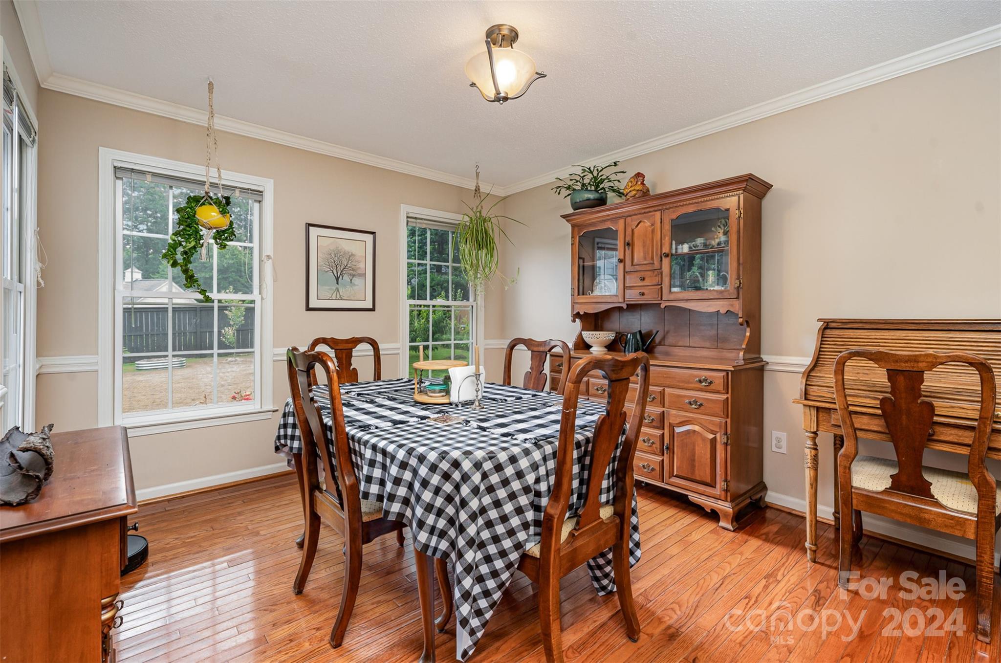 708 1st Avenue North Conover, NC 28613 - Photo 9 of 26 a view of a dining room with furniture a chandelier and wooden floor