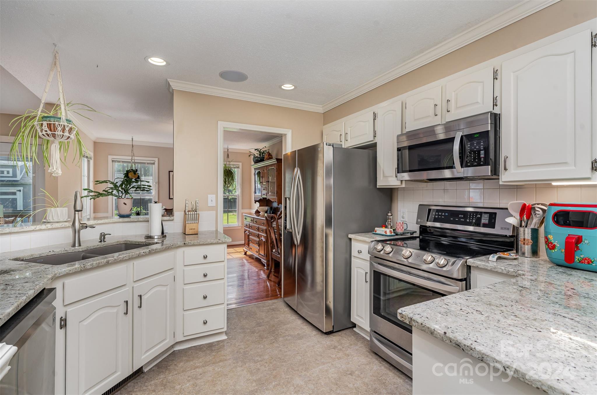 708 1st Avenue North Conover, NC 28613 - Photo 10 of 26 a kitchen with granite countertop a sink stainless steel appliances and cabinets