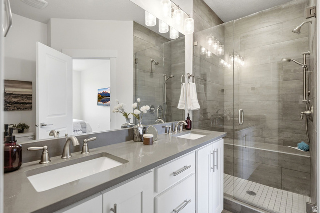 3355 Santa Fe Road Park City, UT 84098 - Photo 17 of 45 Bathroom featuring a double vanity with grey countertops, dual undermount sinks, and brushed nickel fixtures