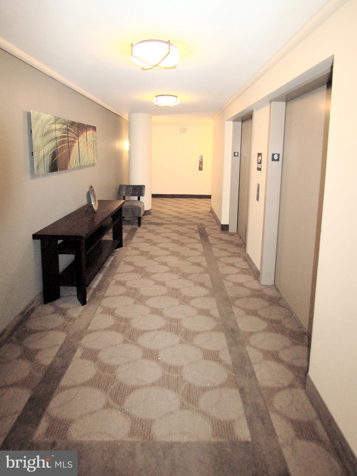 1245 13th Street Northwest, Unit 615 Washington, DC 20005 - Photo 11 of 18 a view of a hallway with front door