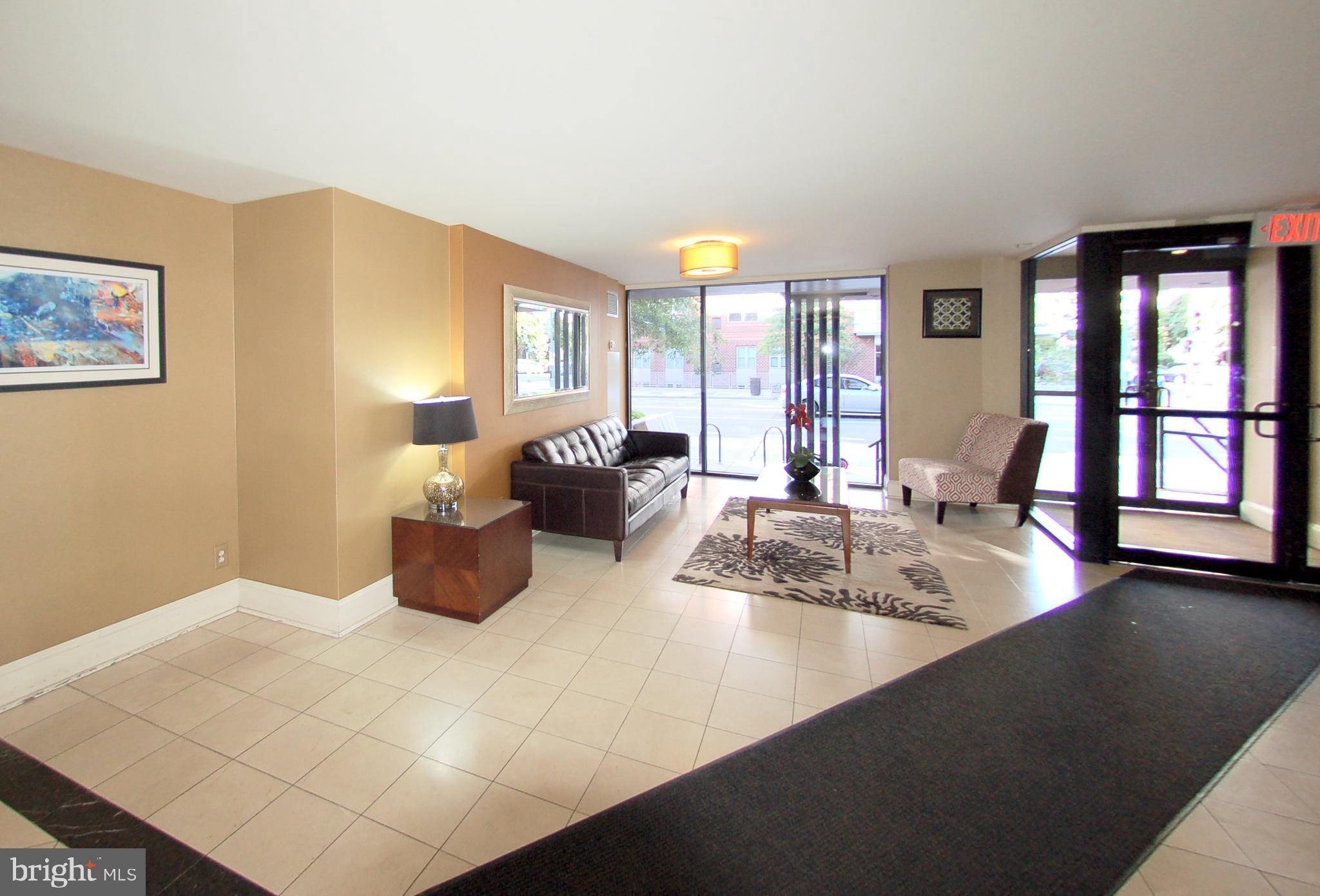1245 13th Street Northwest, Unit 615 Washington, DC 20005 - Photo 13 of 18 a large living room with furniture and large window