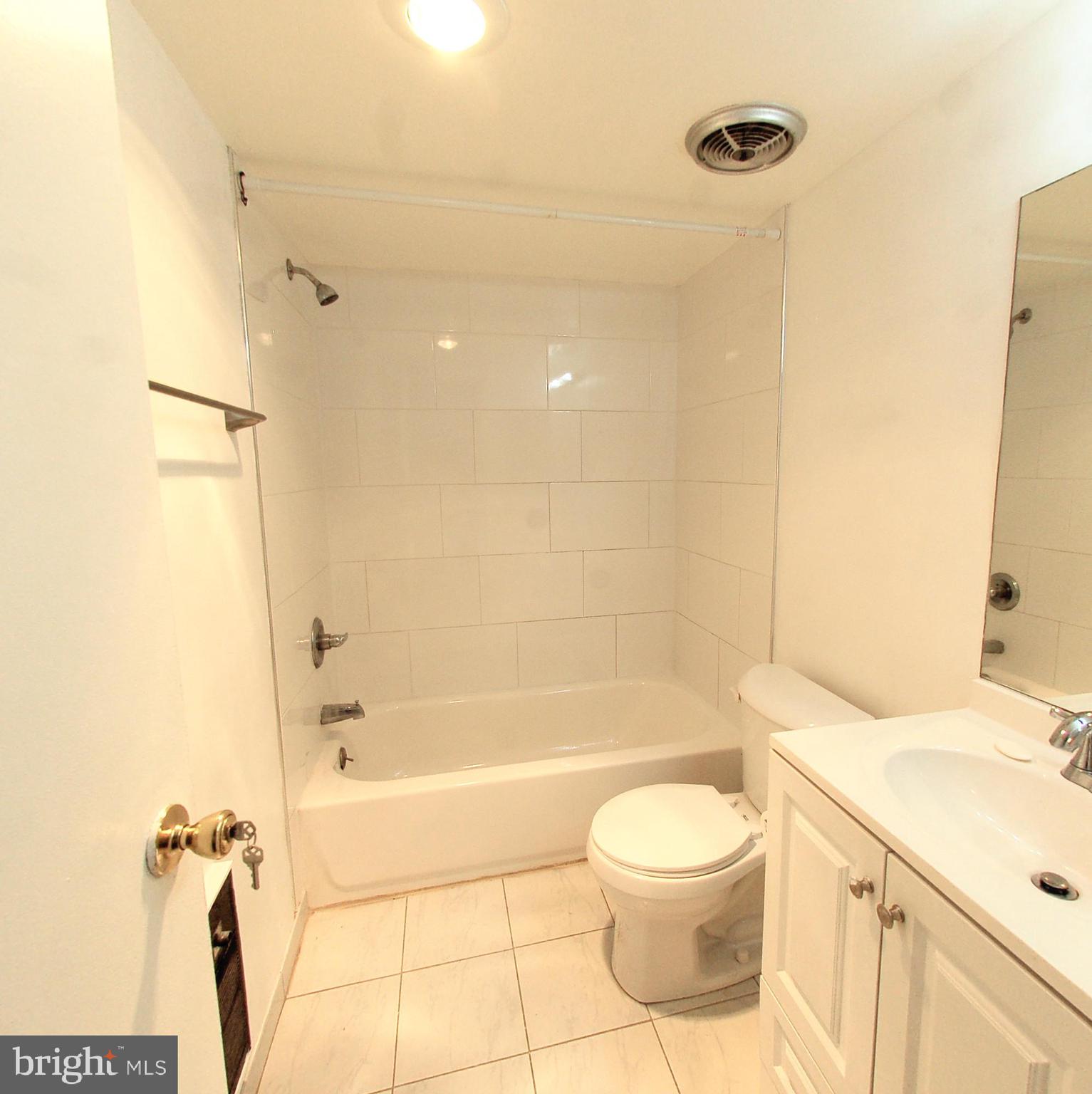 1245 13th Street Northwest, Unit 615 Washington, DC 20005 - Photo 3 of 18 a bathroom with a toilet sink and shower