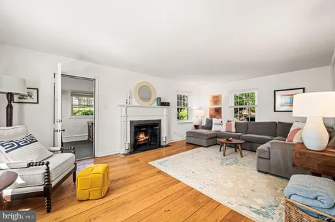 a living room with furniture or couch and a fireplace